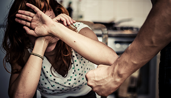 A person defending themselves from an aggressive gesture, potentially for use in legal defense context.